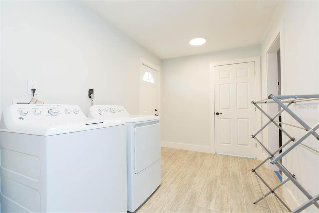 1613 Druid Road Clearwater, FL 33756 - Photo 27 of 47 a utility room with dryer and washer