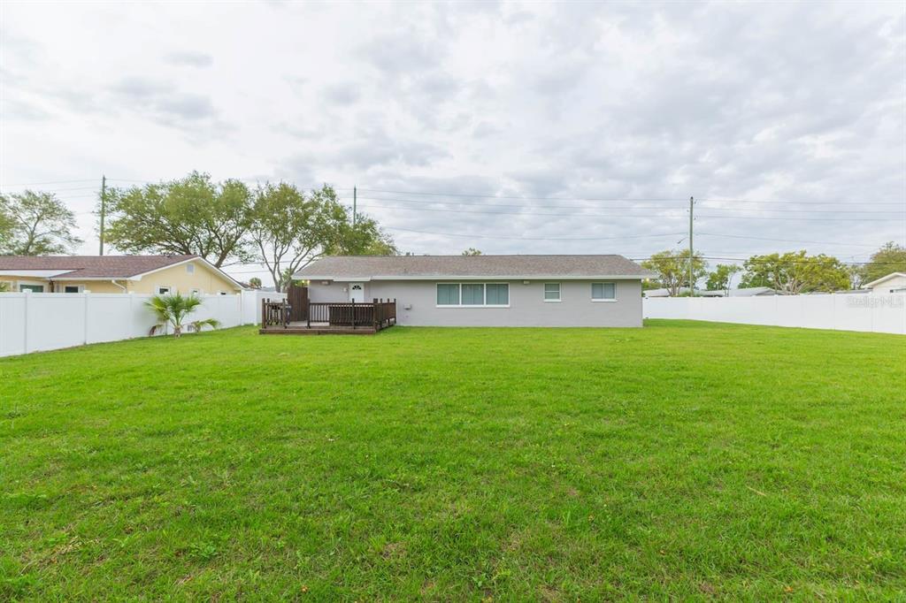 1613 Druid Road Clearwater, FL 33756 - Photo 43 of 47 a front view of house with garden