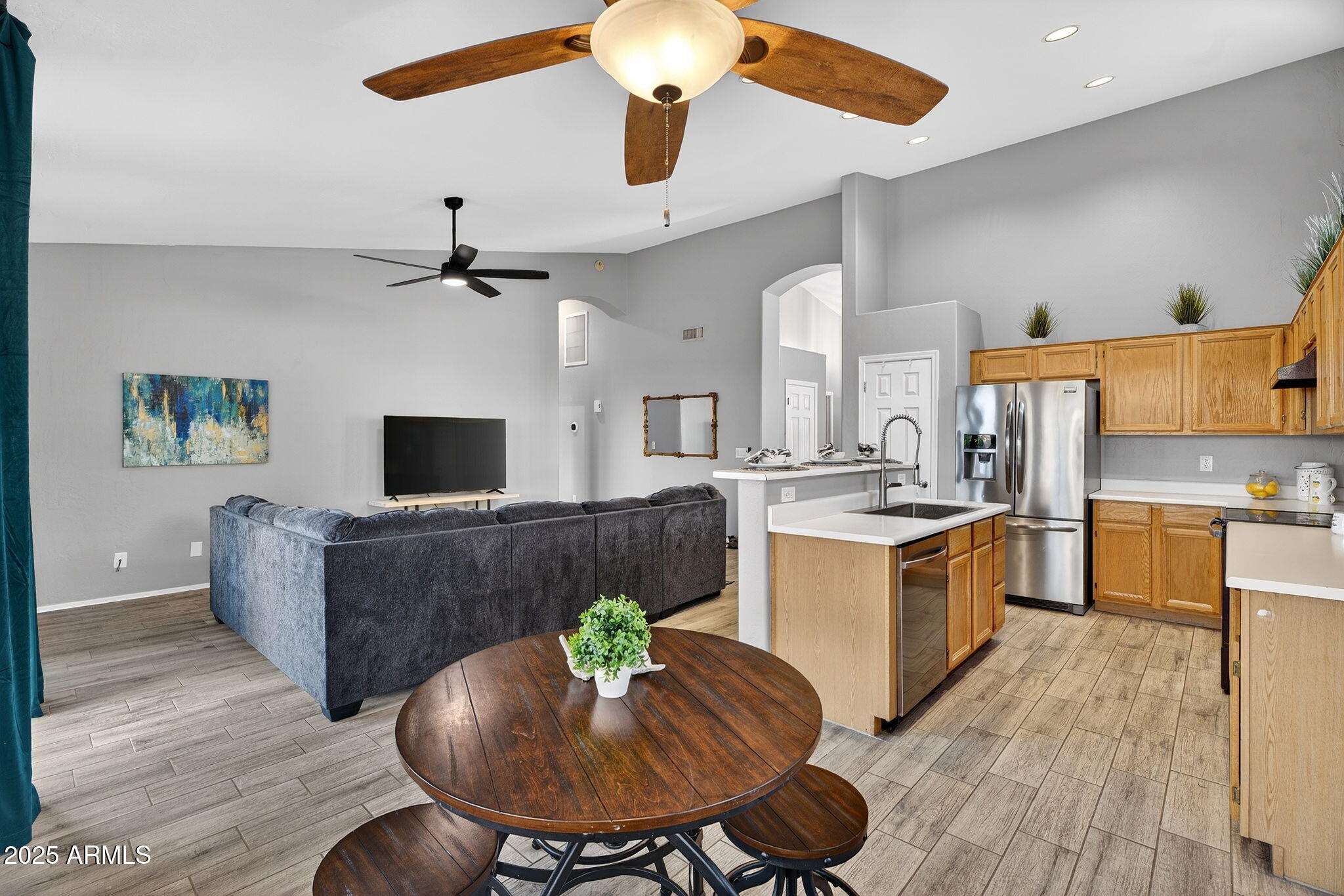 15427 South 16th Avenue Phoenix, AZ 85045 - Photo 10 of 53 a living room with furniture and a wooden floor