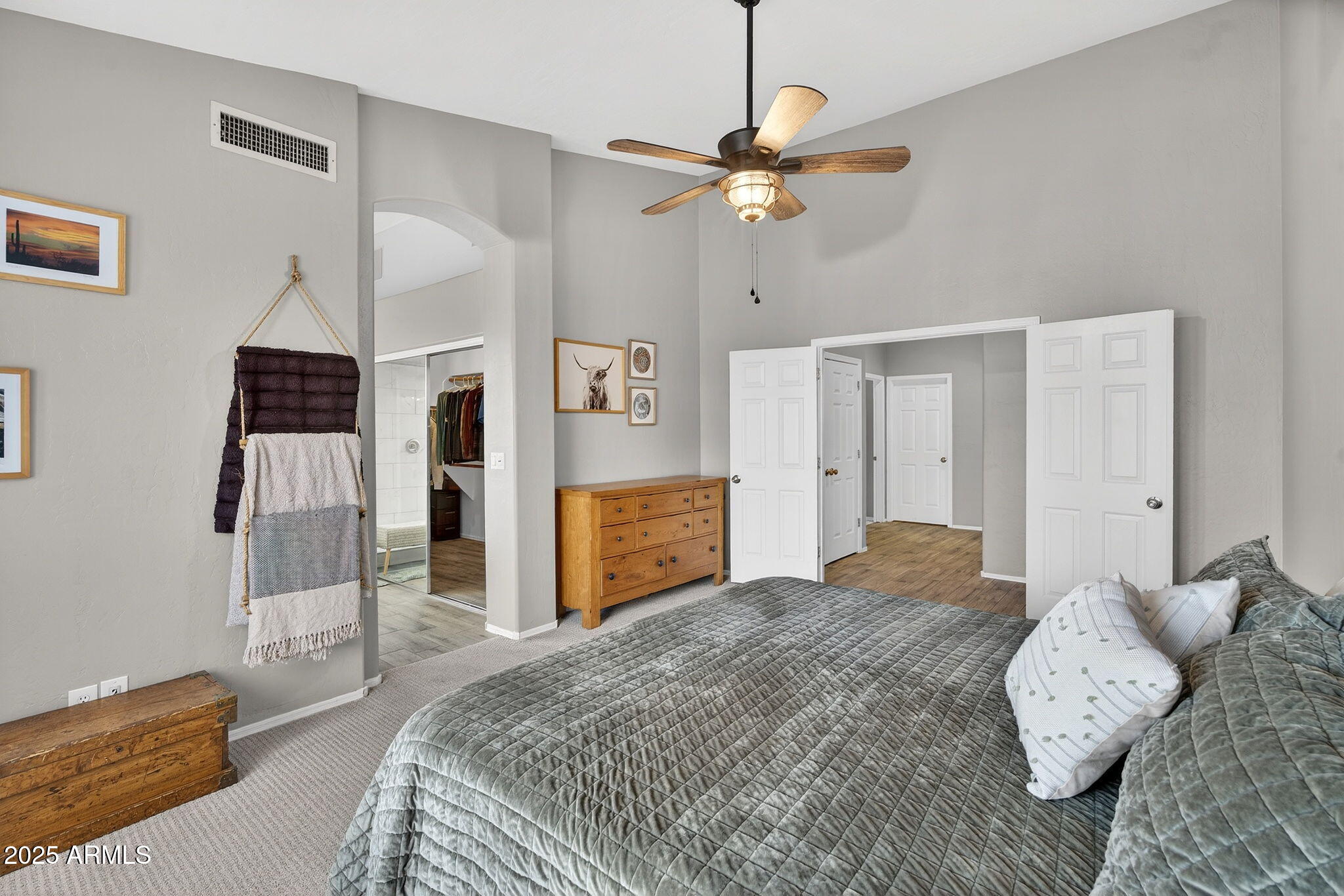 15427 South 16th Avenue Phoenix, AZ 85045 - Photo 18 of 53 a bedroom with a bed and a chandelier