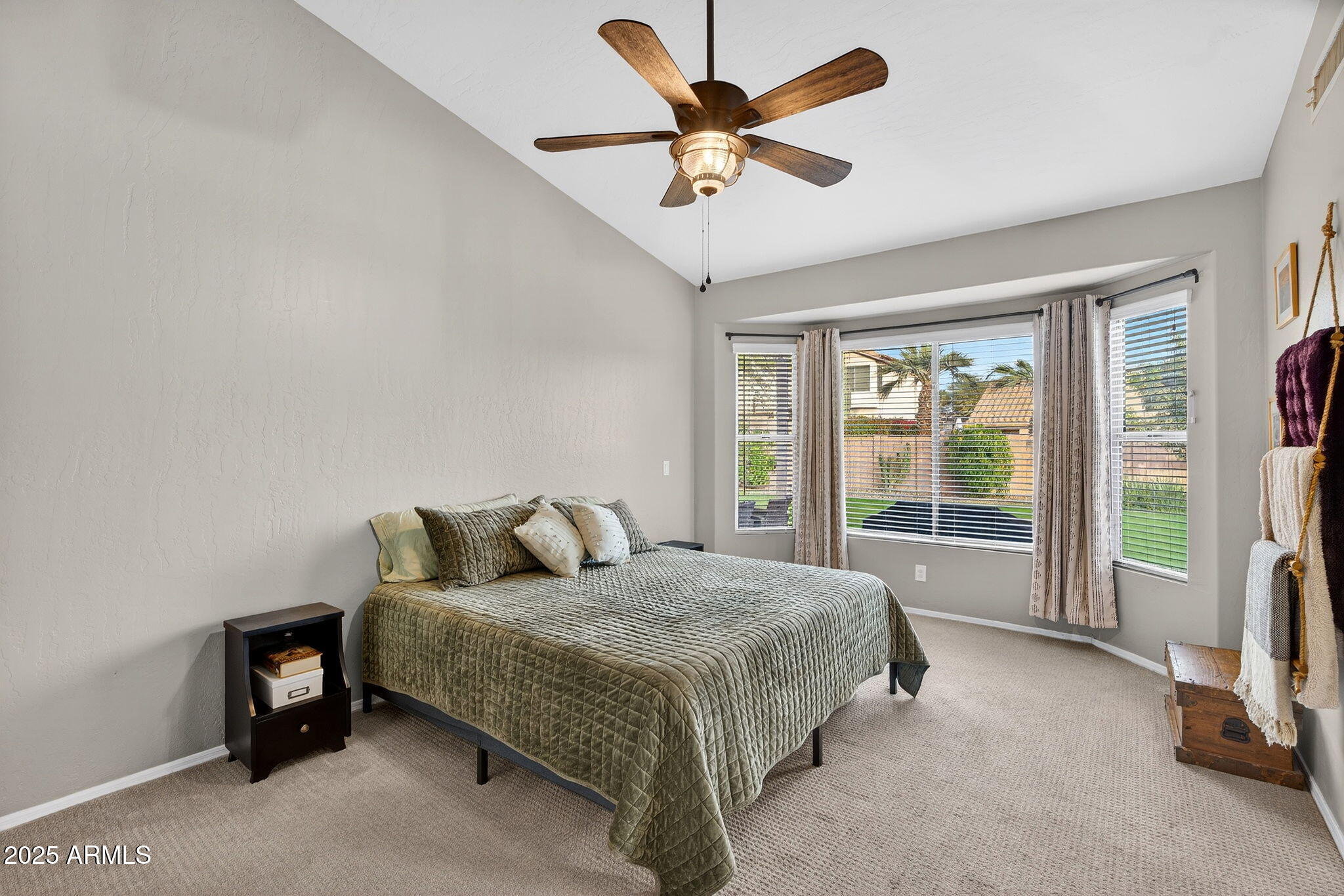 15427 South 16th Avenue Phoenix, AZ 85045 - Photo 19 of 53 a bedroom with a bed painting and a large window