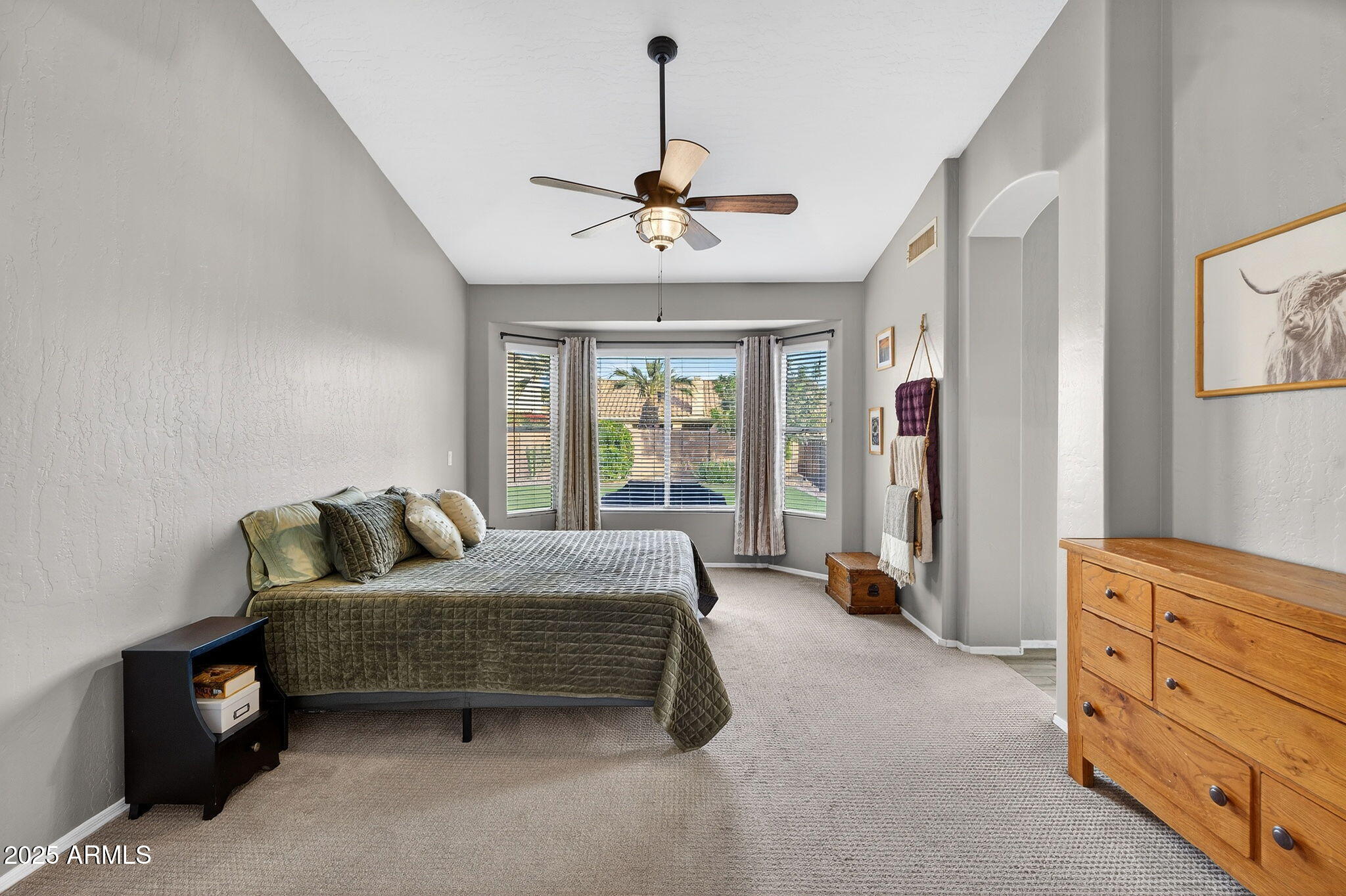 15427 South 16th Avenue Phoenix, AZ 85045 - Photo 20 of 53 a bedroom with a bed and ceiling fan