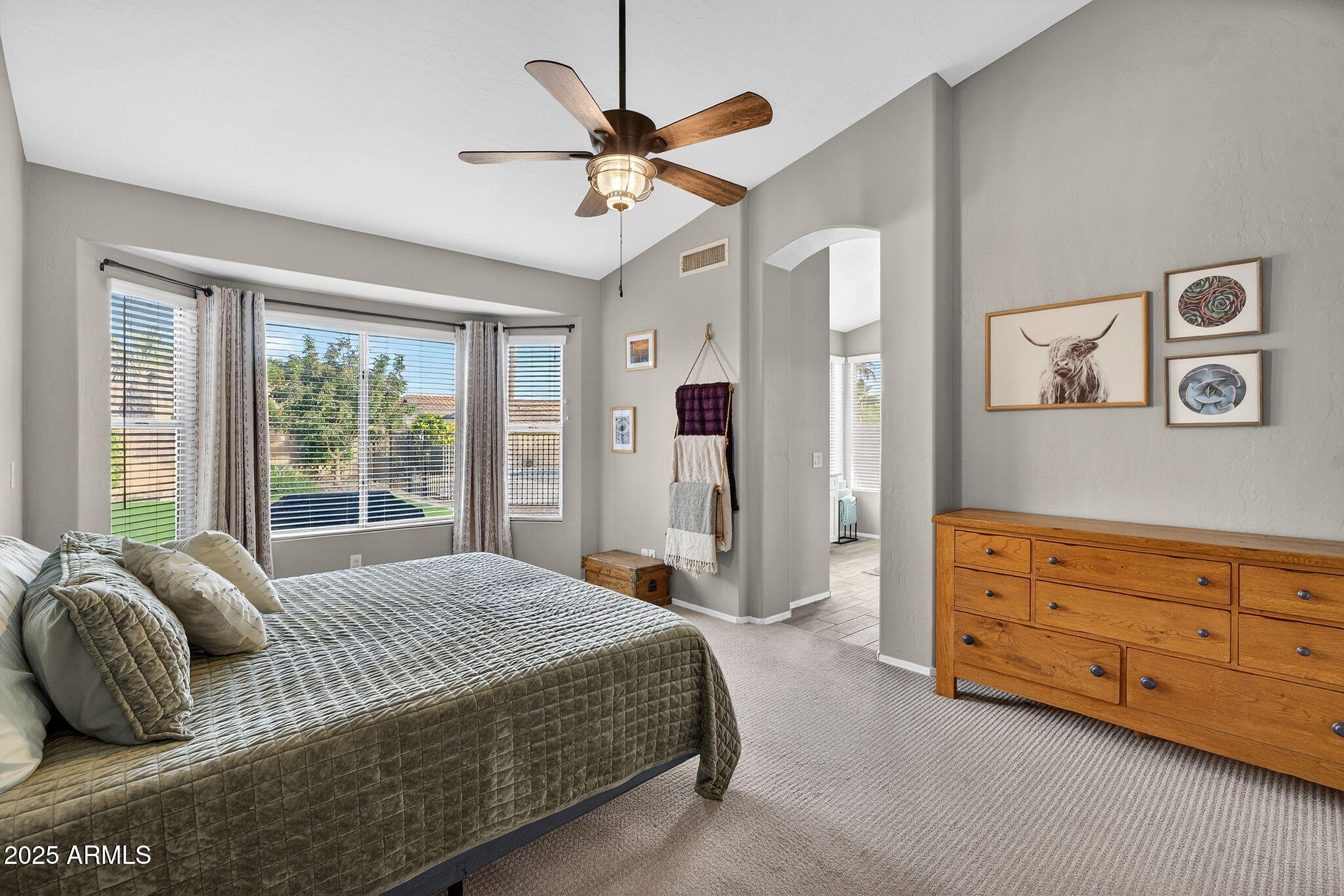 15427 South 16th Avenue Phoenix, AZ 85045 - Photo 21 of 53 a spacious bedroom with a bed and ceiling fan