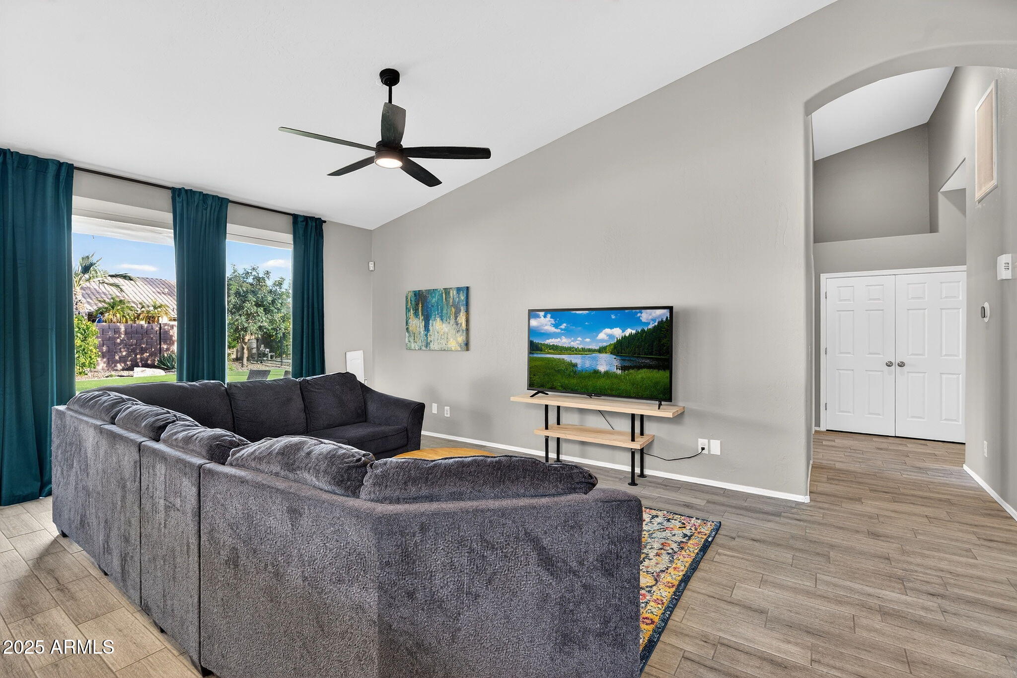 15427 South 16th Avenue Phoenix, AZ 85045 - Photo 2 of 53 a living room with furniture and a flat screen tv