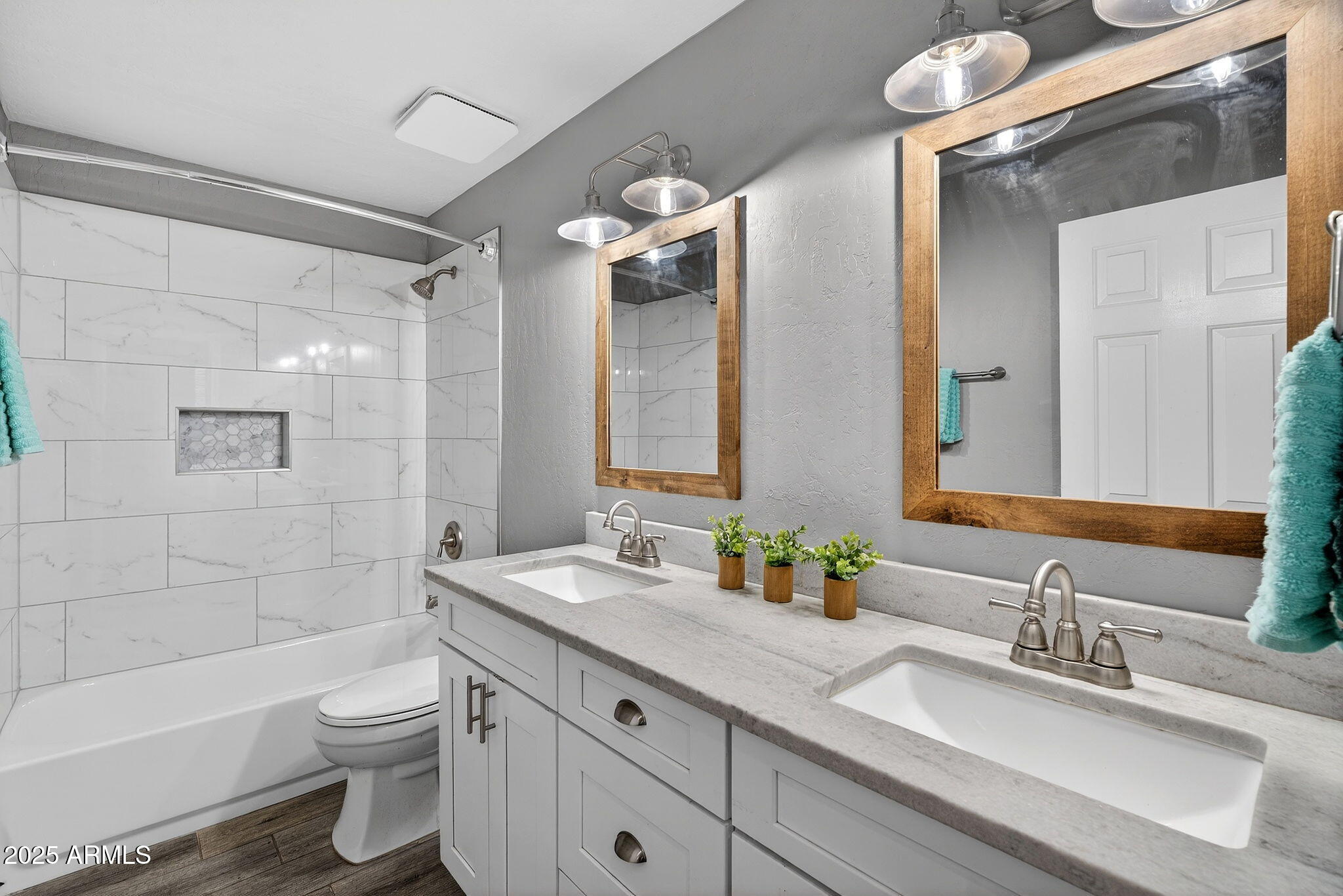 15427 South 16th Avenue Phoenix, AZ 85045 - Photo 31 of 53 a bathroom with a double vanity sink toilet mirror and bathtub