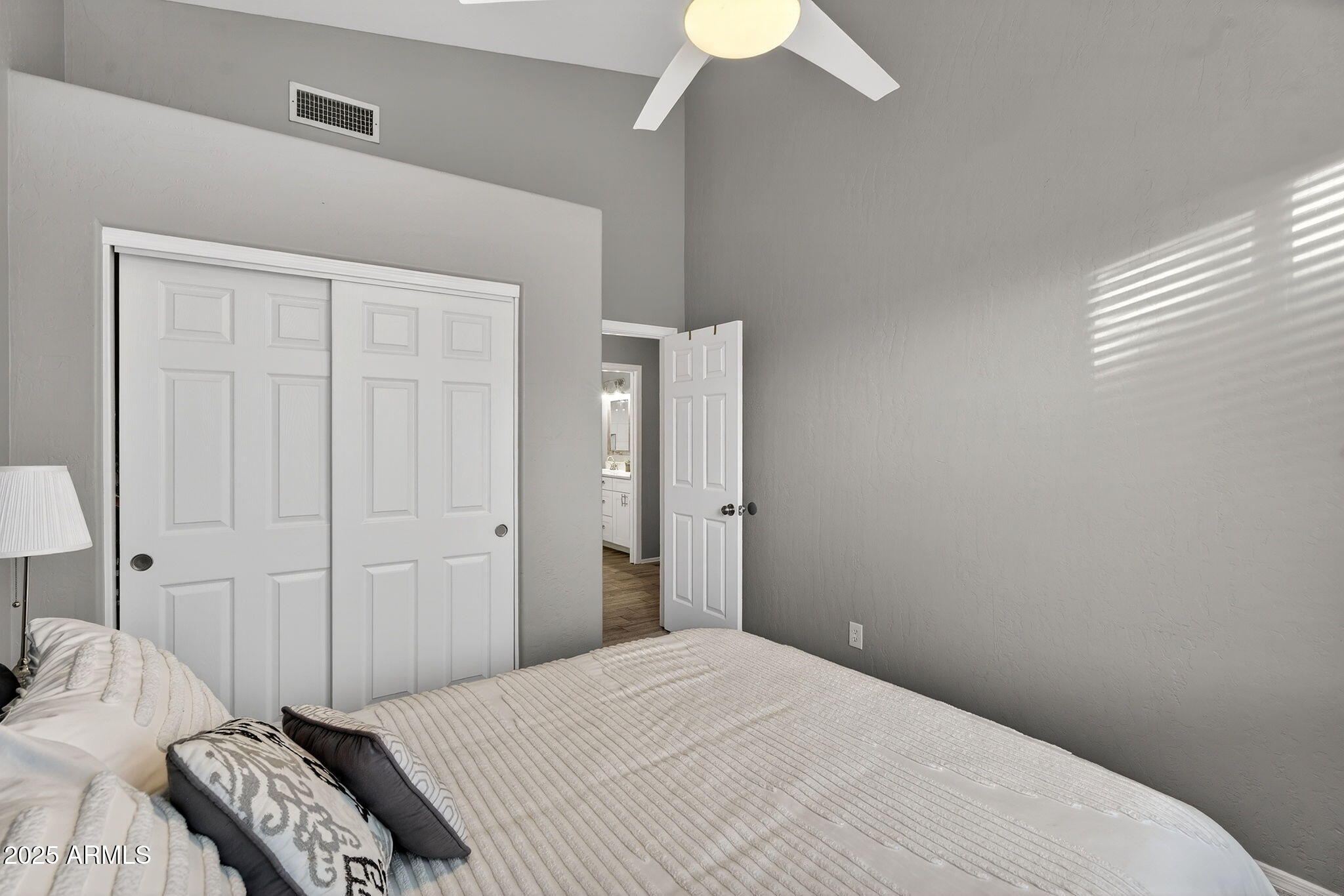 15427 South 16th Avenue Phoenix, AZ 85045 - Photo 36 of 53 a bedroom with a bed and a chandelier