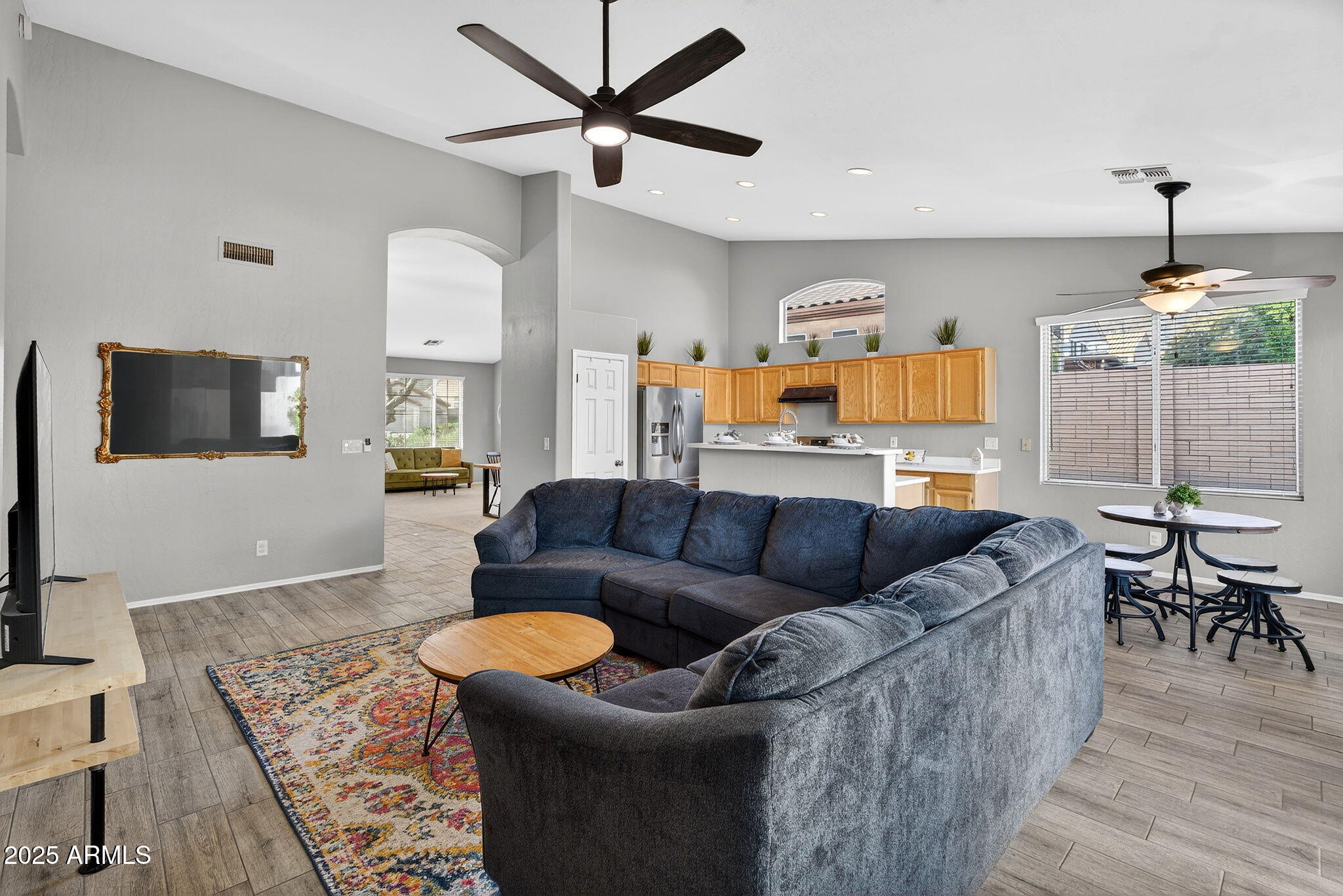 15427 South 16th Avenue Phoenix, AZ 85045 - Photo 3 of 53 a living room with furniture and a flat screen tv