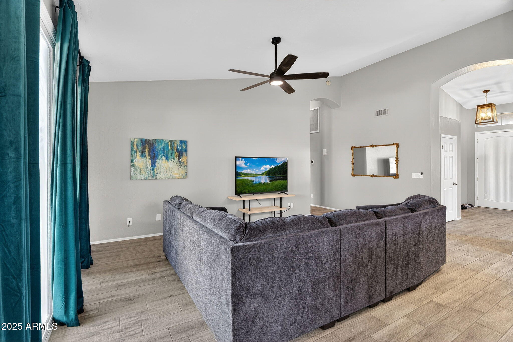 15427 South 16th Avenue Phoenix, AZ 85045 - Photo 4 of 53 a living room with furniture and a flat screen tv