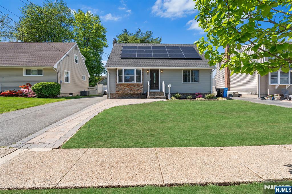 71 Wingra Avenue Rutherford, NJ 07070 - Photo 1 of 20 a house view with a sitting space and garden