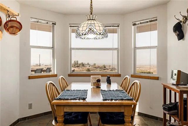 a bathroom with a toilet and a shower curtain