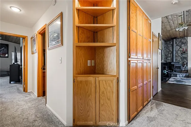a bathroom with a granite countertop sink mirror vanity and toilet