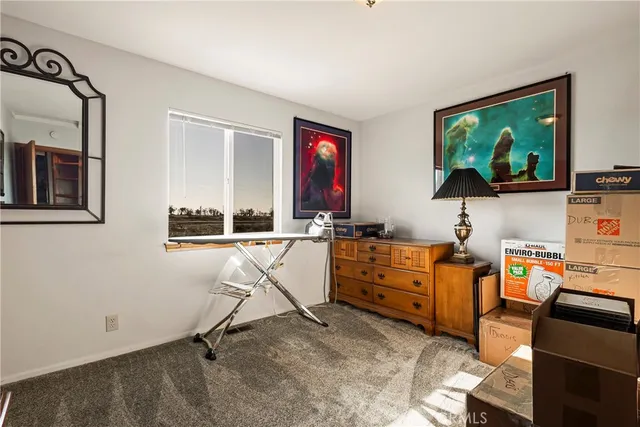 a view of a swimming pool with an outdoor seating and a garden