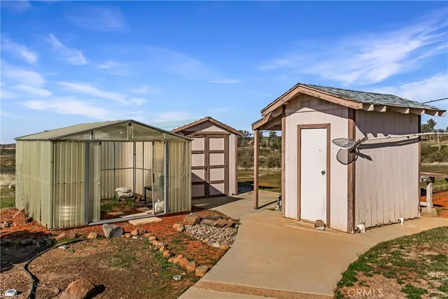 an aerial view of a residential houses with outdoor space