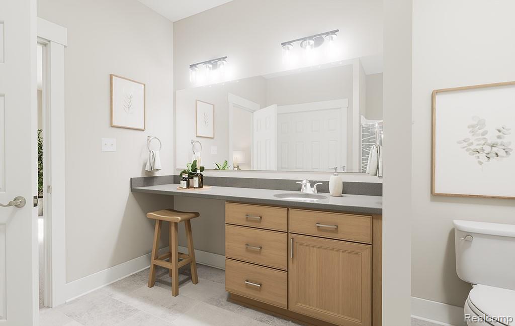 61659 Empire Road South Lyon, MI 48178 - Photo 16 of 21 Bathroom featuring vanity and light tile patterned floors