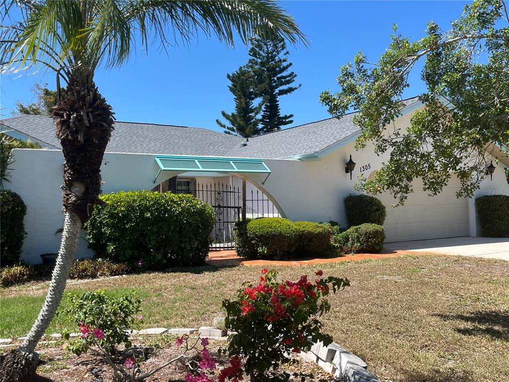 1305 Alton Road Port Charlotte, FL 33952 - Photo 1 of 1 a front view of a house with a yard