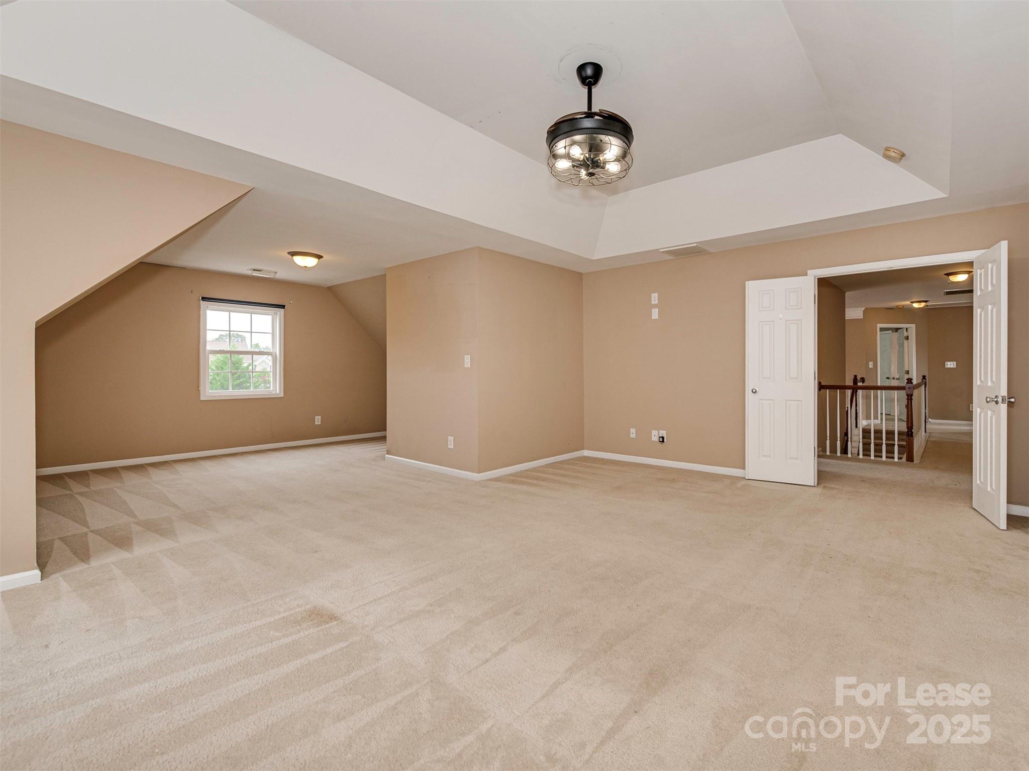 5607 Fulton Ridge Drive Indian Trail, NC 28079 - Photo 17 of 27 a view of an empty room with window and kitchen view