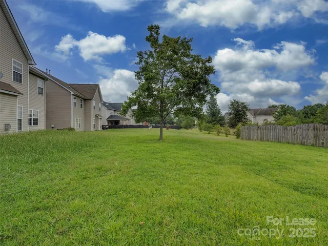 a view of a yard with outdoor seating