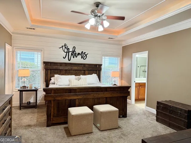 a spacious bathroom with a sink and a mirror