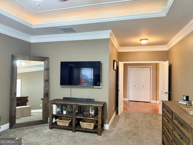 a spacious bathroom with a tub sink and mirror