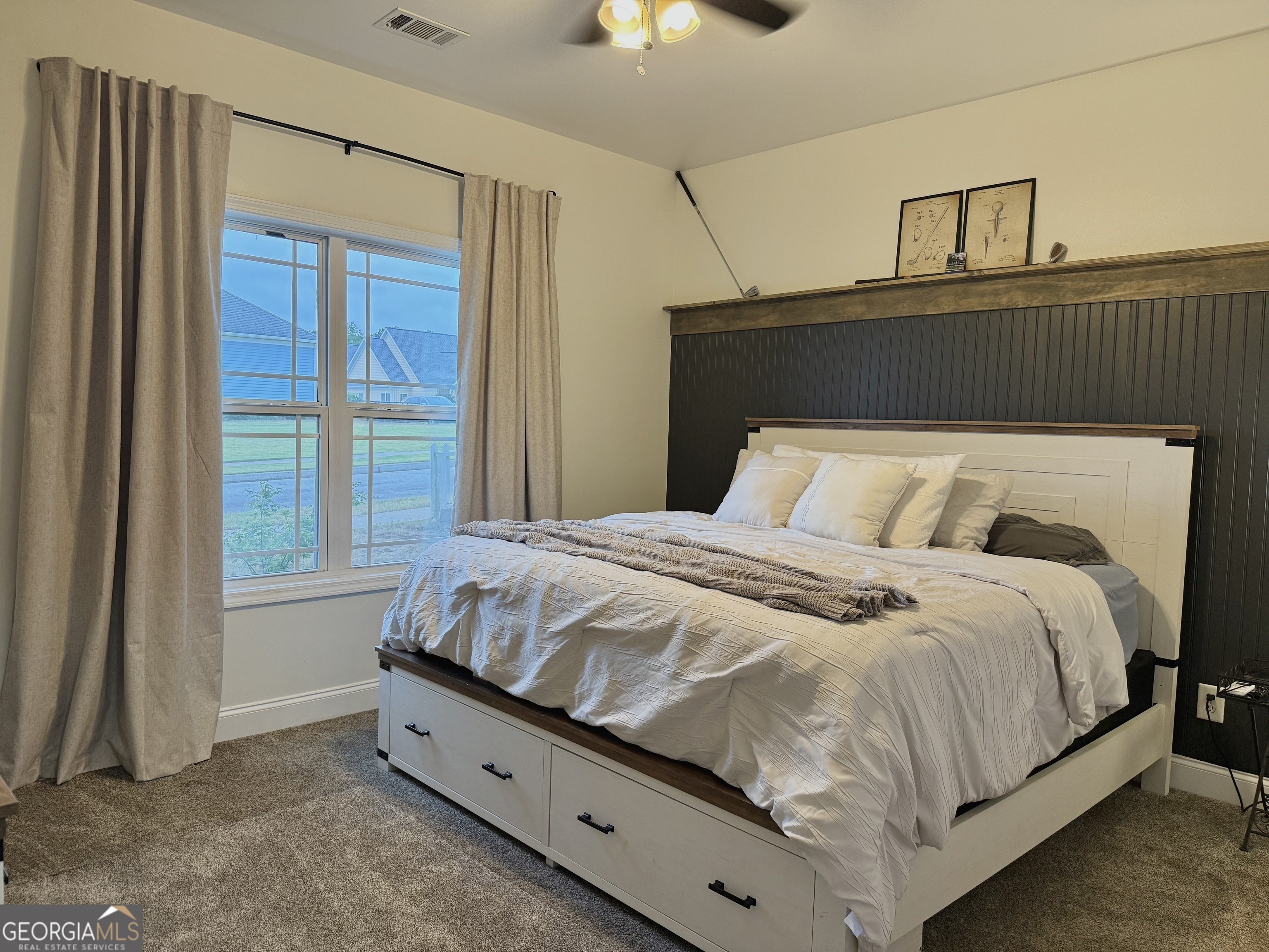 226 Rogue Road Social Circle, GA 30025 - Photo 19 of 23 a bedroom with a bed and window