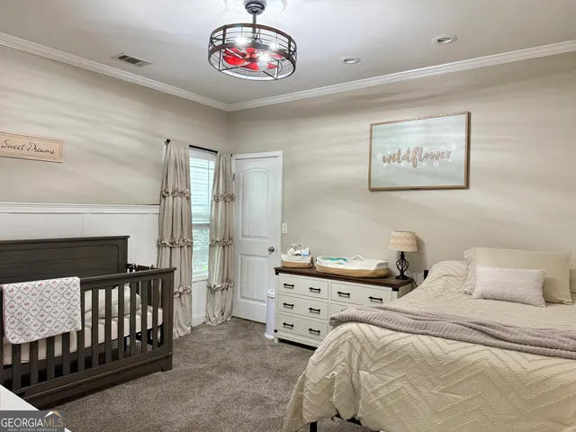 a bedroom with furniture and a window