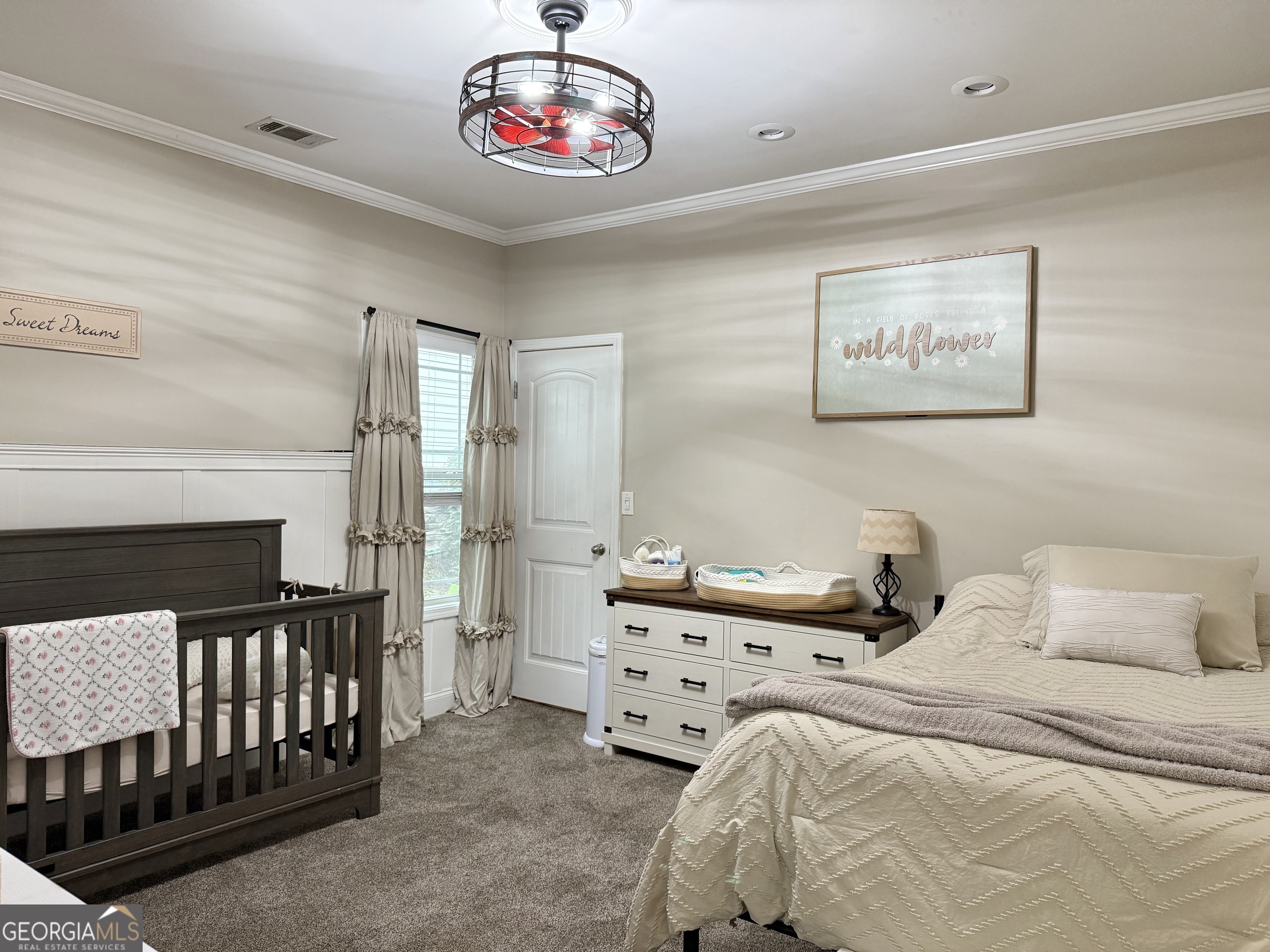 226 Rogue Road Social Circle, GA 30025 - Photo 20 of 23 a bedroom with a bed and a chandelier