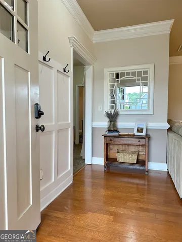 a living room with furniture and a large mirror
