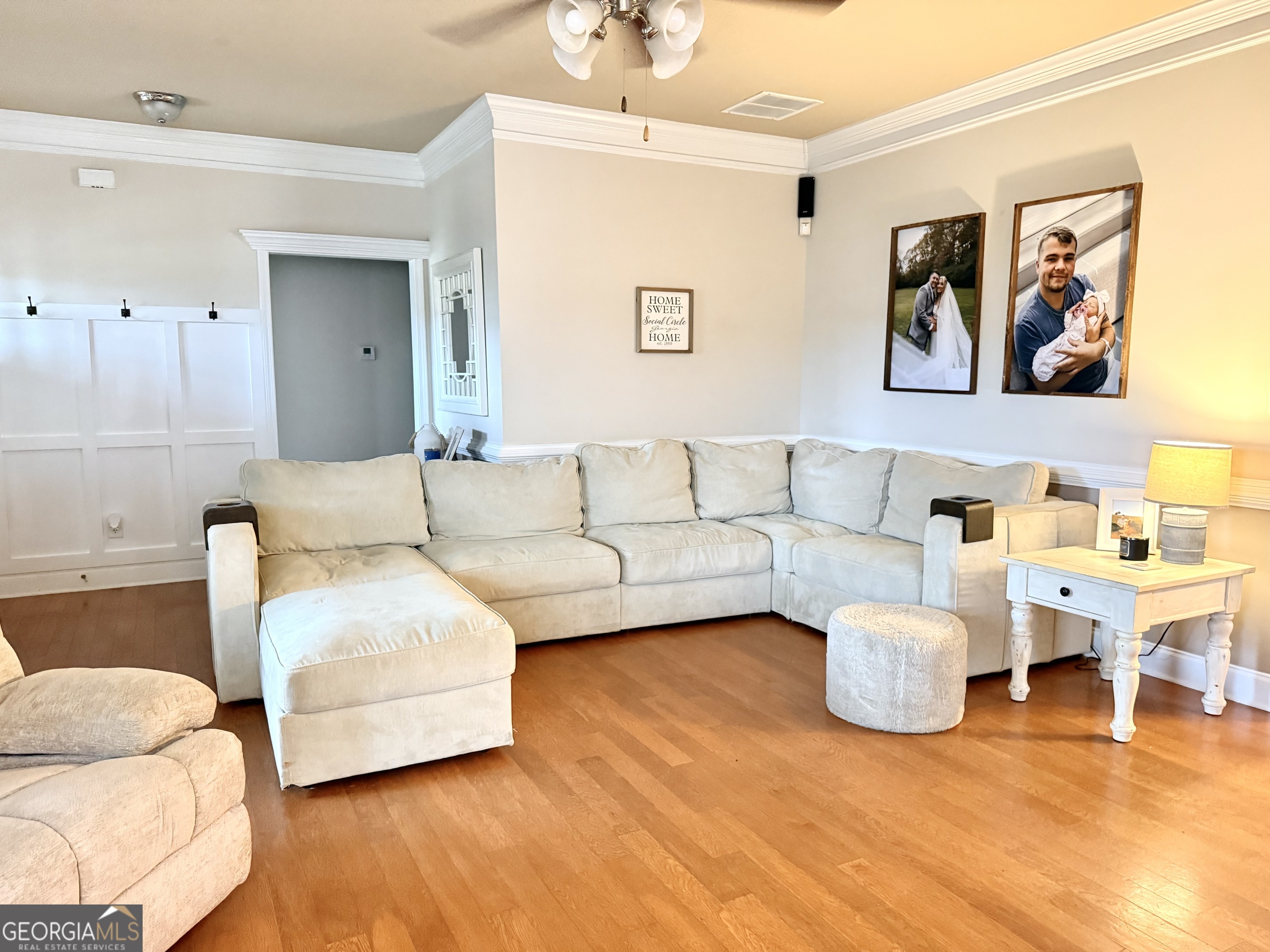 226 Rogue Road Social Circle, GA 30025 - Photo 5 of 23 a living room with furniture and a wooden floor