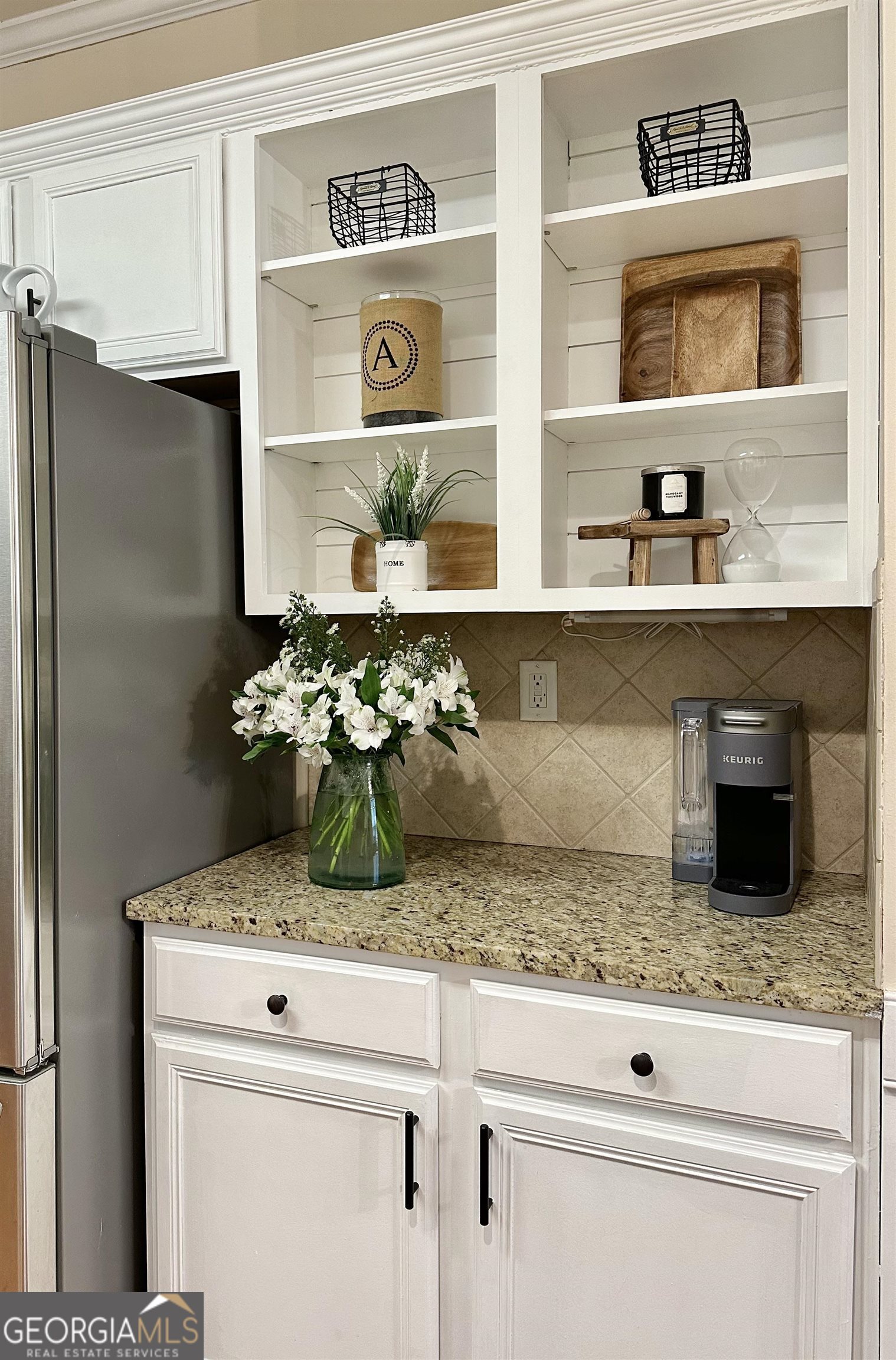 226 Rogue Road Social Circle, GA 30025 - Photo 10 of 23 a kitchen with granite countertop a refrigerator and a stove