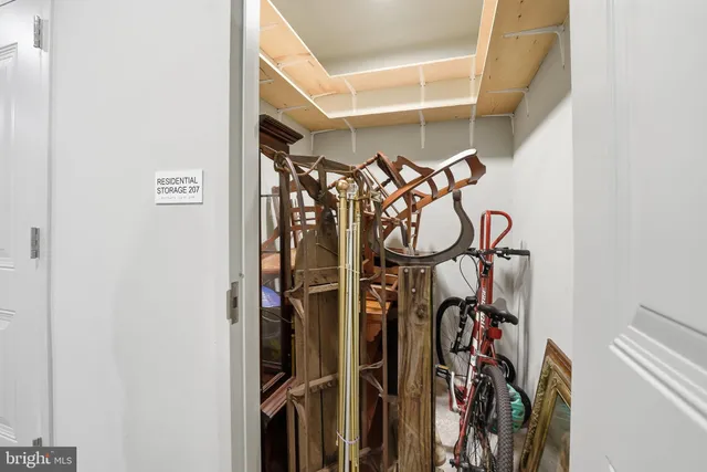 a view of walk in closet with clothes