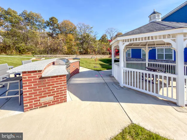 a view of a brick house with a yard