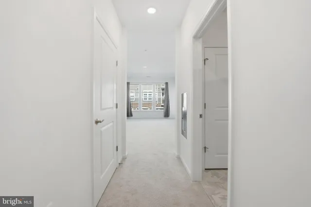 a view of a hallway with shelves