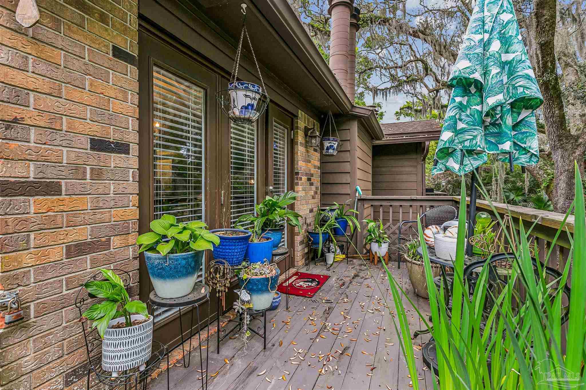 4831 East Olive Road, Unit 2D Pensacola, FL 32514 - Photo 26 of 29 a view of path along with potted plant