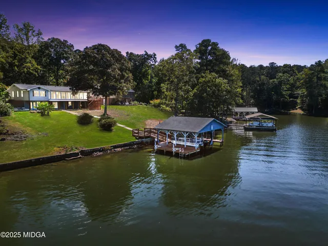 a view of a lake with a house in the background
