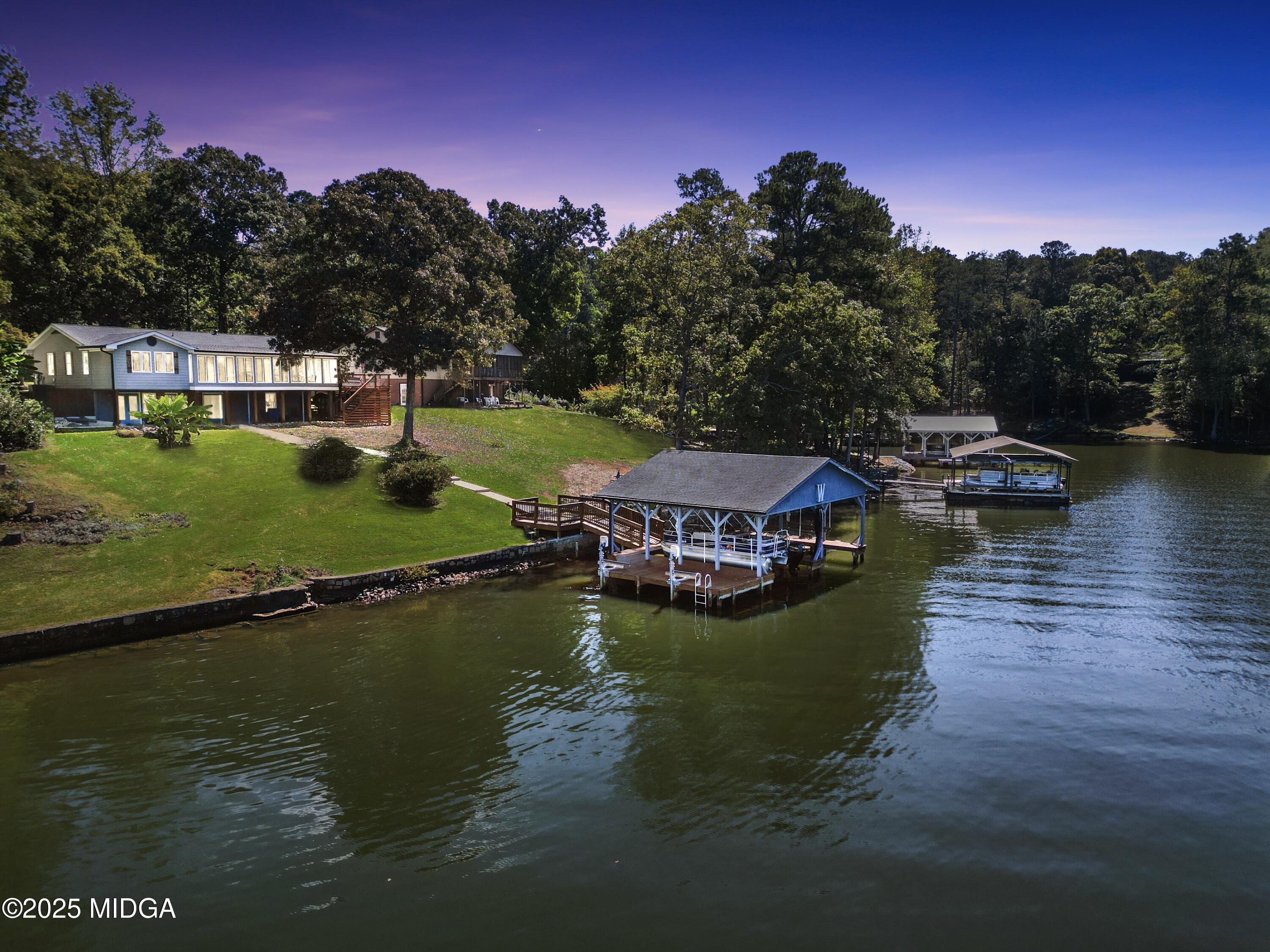 a view of a lake with a house in the background