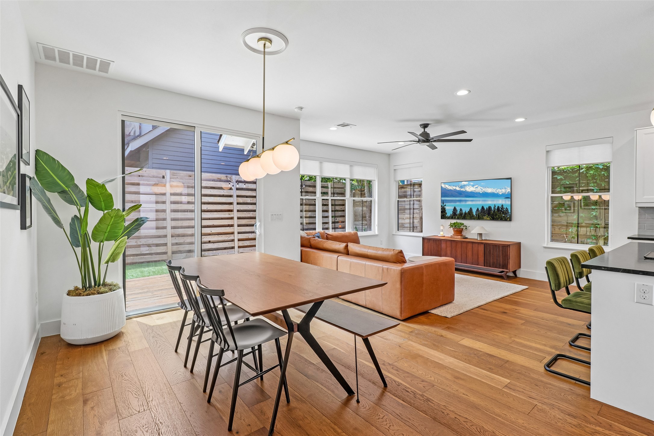 1706 Perez Street, Unit 1 Austin, TX 78721 - Photo 8 of 36 Hardwood floors and generous natural light define this welcoming open-concept living and dining space.