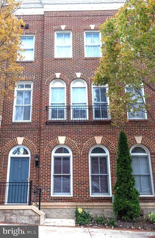 front view of brick house with a windows