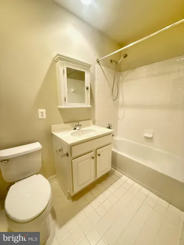 a bathroom with a sink a toilet and a bathtub