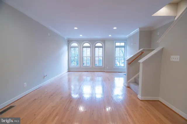 a view of a living room with furniture and a fireplace