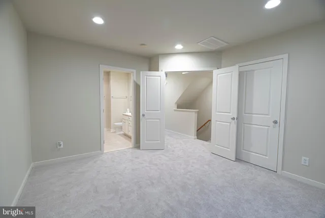 a bathroom with a double vanity sink mirror and toilet