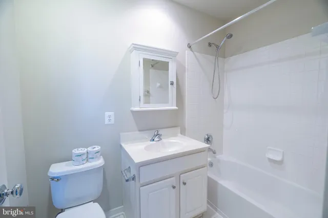 a view of an empty room and closet area