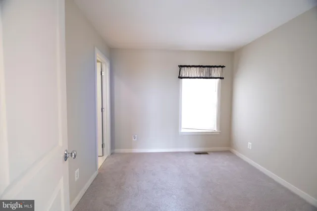 an empty room with a natural light