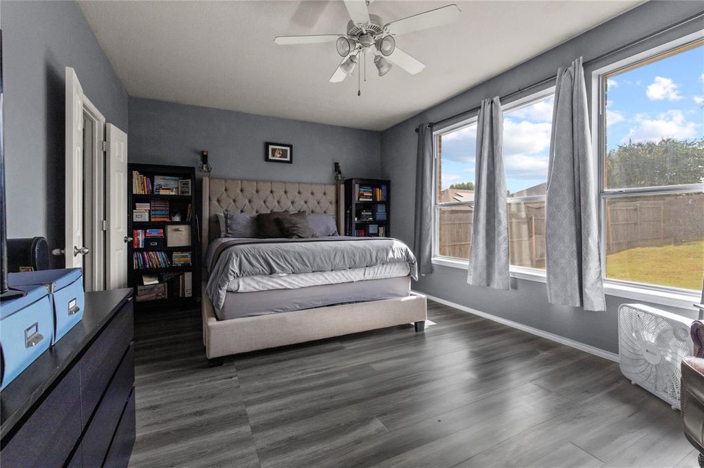 4100 Chisos Rim Trail Fort Worth, TX 76244 - Photo 12 of 30 a spacious bedroom with a large bed and a large window