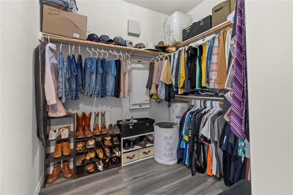 4100 Chisos Rim Trail Fort Worth, TX 76244 - Photo 17 of 30 a view of walk in closet with clothes and shoes