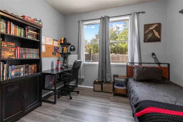 a aerial view of a house with large trees