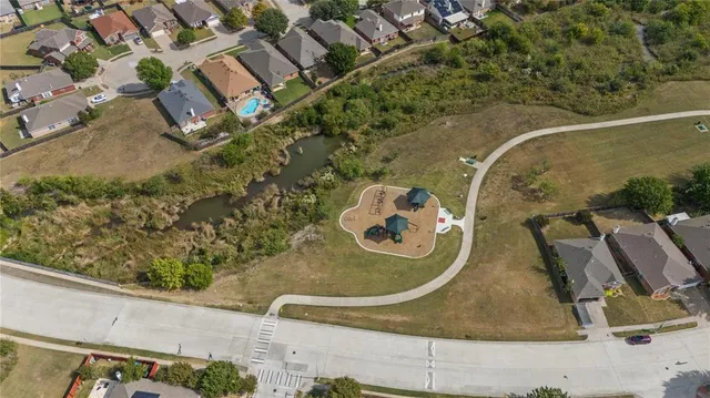 an aerial view of house with a swimming pool