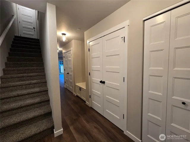 a bathroom with a glass shower door and a sink