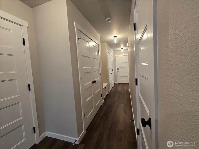 a view of a bathroom from a hallway
