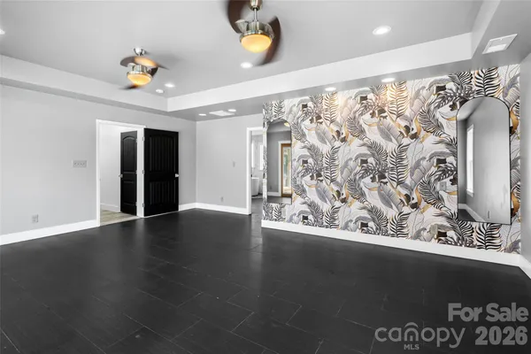 a view of a garage with wooden floor