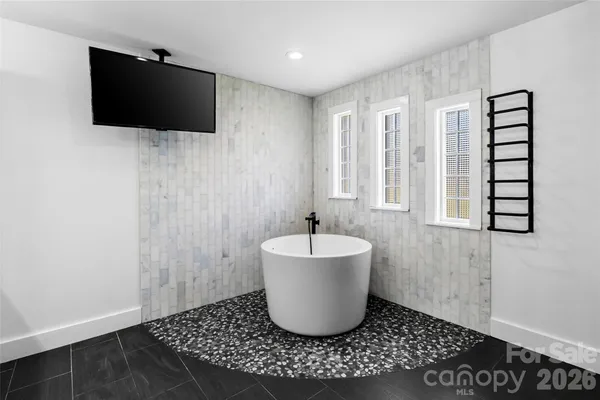 a living room with a couch and a flat screen tv